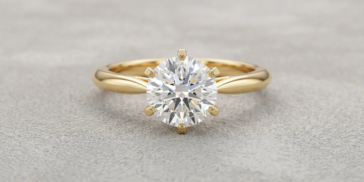 Round solitaire ring with six prong wire crown