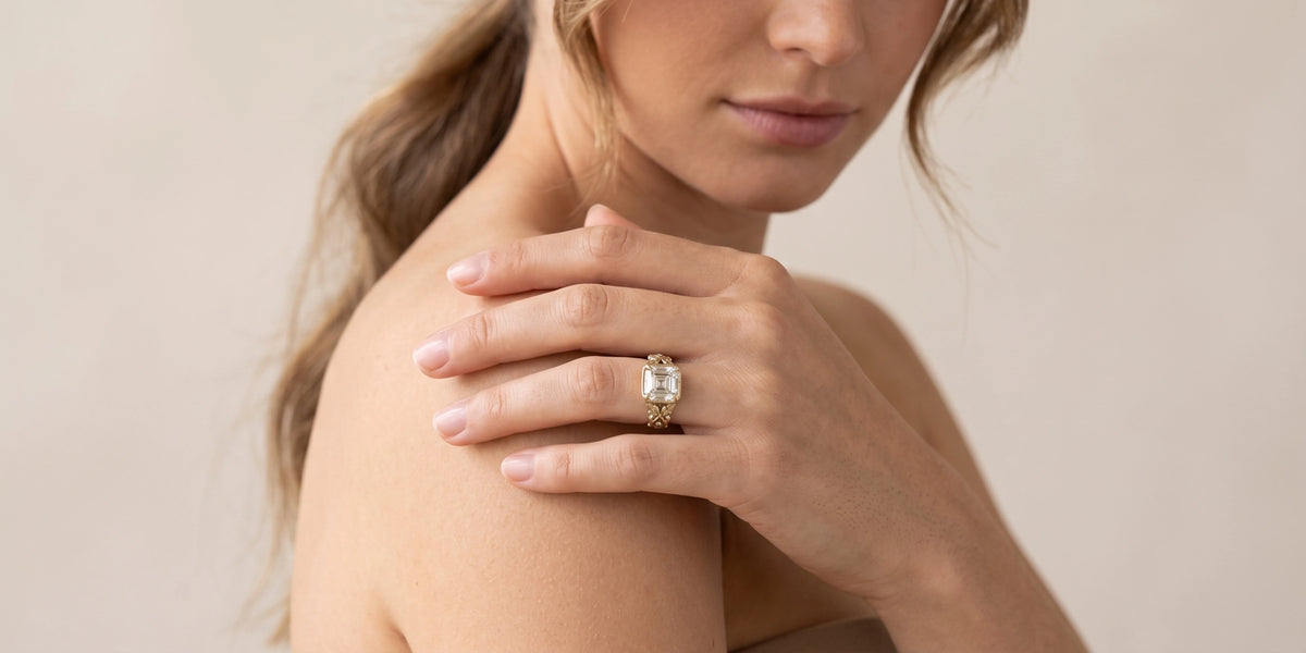 Vintage asscher cut engagement ring with intertwined vine leaf motif: nature inspired elegance with antique charm