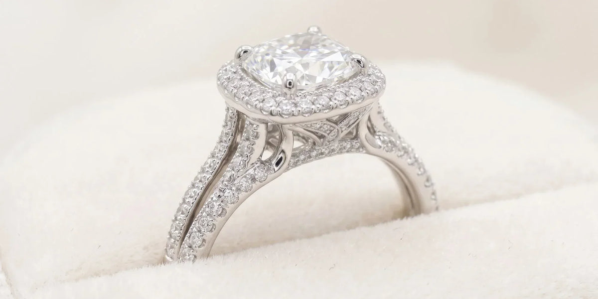 Vintage glamour with a hidden twist: cushion halo ring with crisscross undergallery accents