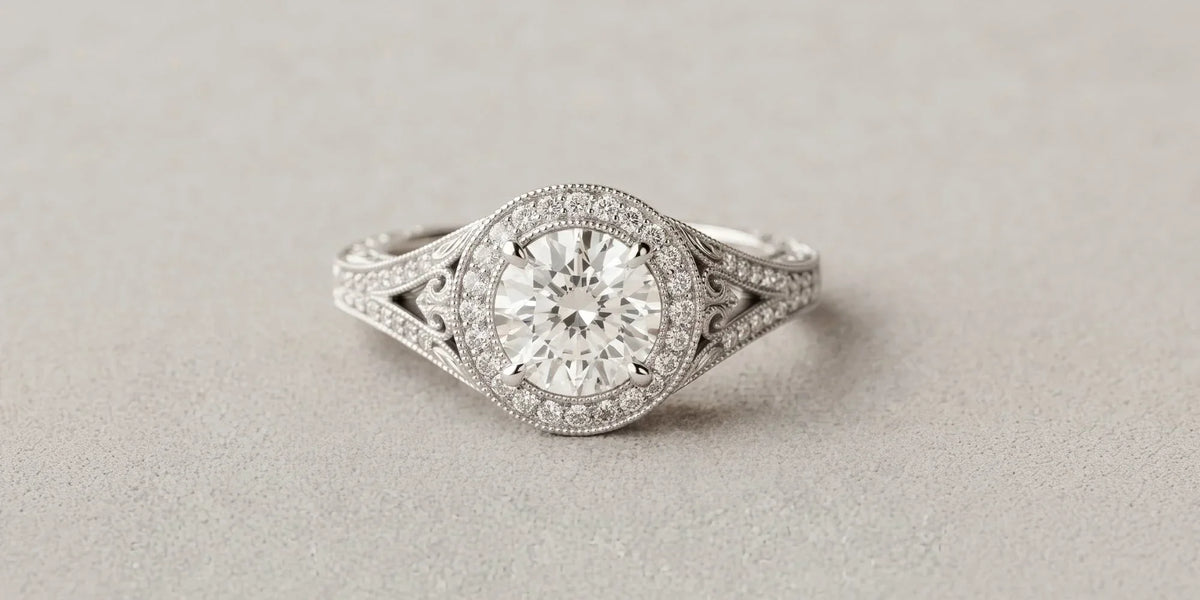 Vintage romance in every detail: round halo ring with ornate filigree cathedral shoulders