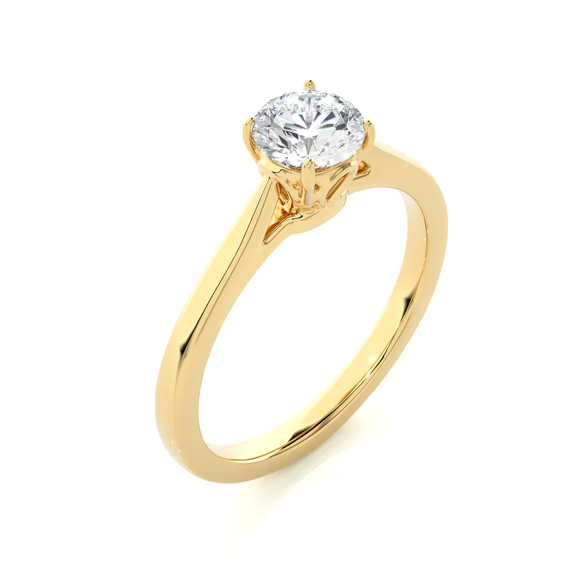 Angled view of 0.75 Carat Round Moissanite Solitaire Engagement Ring in Yellow Gold, showcasing the band and setting.​