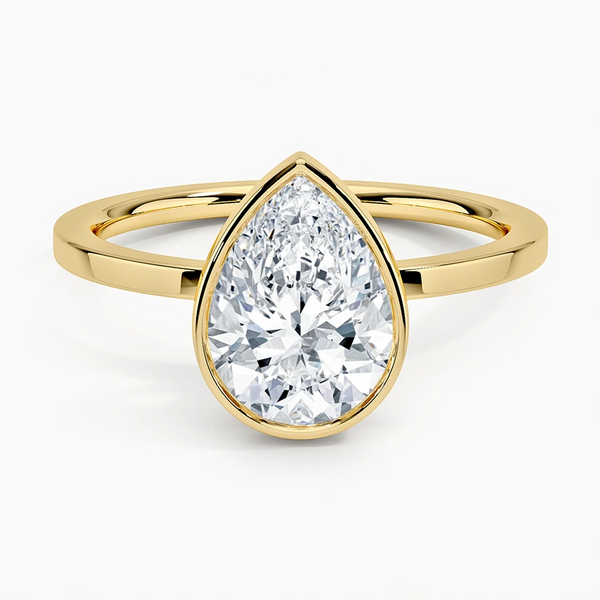 1.50 Ct Pear Cut Moissanite Bezel Set Engagement Ring in Yellow Gold