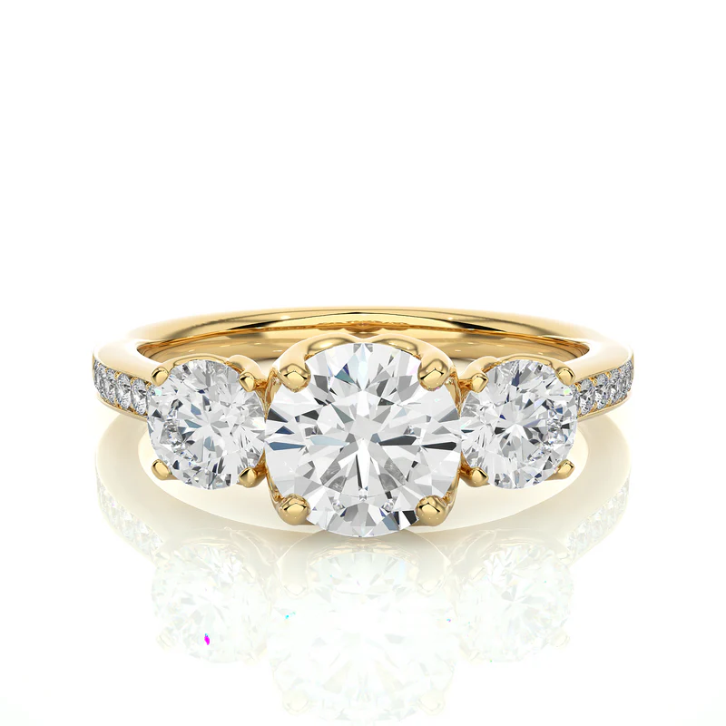 Front view of 2.50 Carat Round Moissanite Three Stone Engagement Ring in Yellow Gold, highlighting the brilliant center moissanite stone.