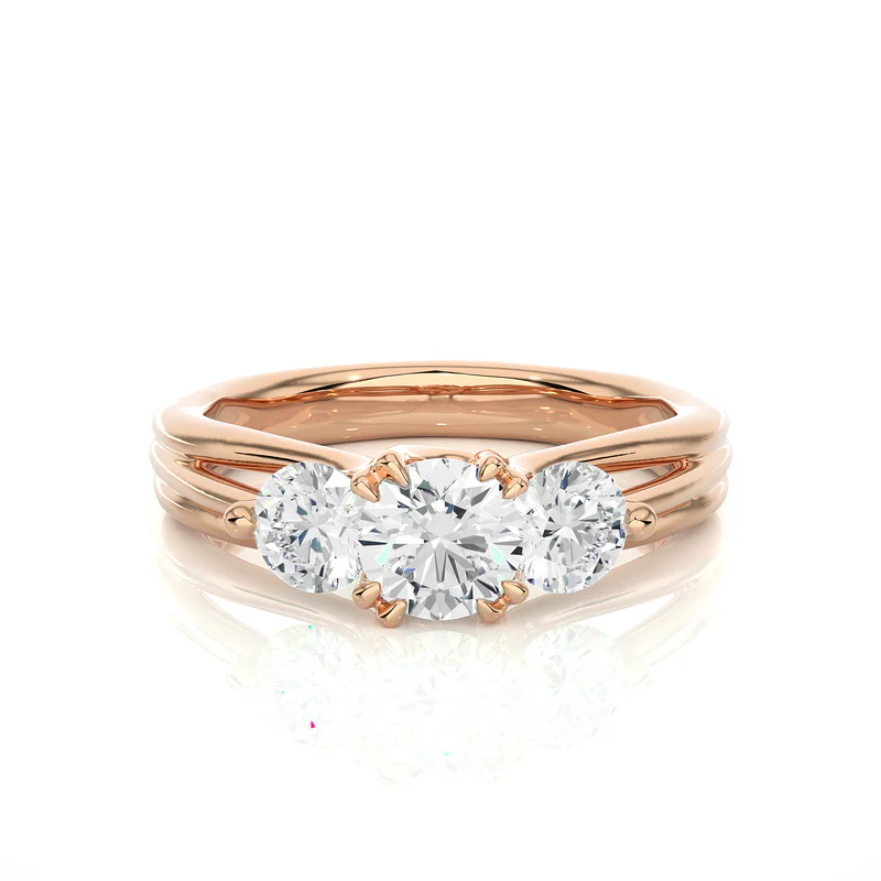 Front view of 2 carat 3 stone round cut moissanite ring in rose gold, highlighting the brilliant center moissanite stone