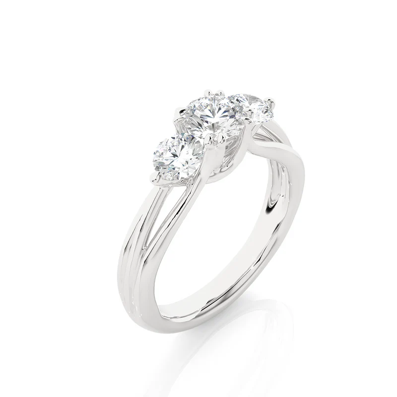 Angled view of 2 carat 3 stone round cut moissanite ring in silver, showcasing the band and setting