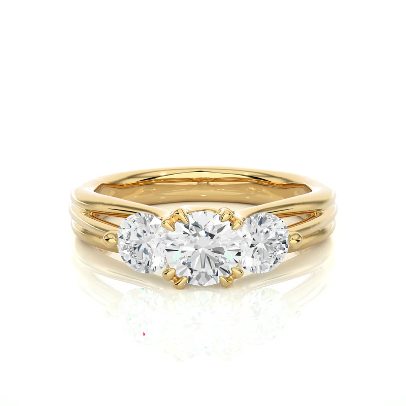 Front view of 2 carat 3 stone round cut moissanite ring in yellow gold, highlighting the brilliant center moissanite stone