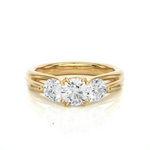Load image into Gallery viewer, Front view of 2 Carat 3 Stone Round Cut Moissanite Ring in Yellow Gold, highlighting the brilliant center moissanite stone.
