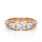 Load image into Gallery viewer, Front view of 2 Ct Moissanite Three Stone Engagement Ring with Accent in Rose Gold, highlighting the brilliant center moissanite stone.
