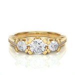Load image into Gallery viewer, Front view of 2 Ct Moissanite 3 Stone Engagement Ring With Accents in Yellow Gold, highlighting the brilliant center moissanite stone.
