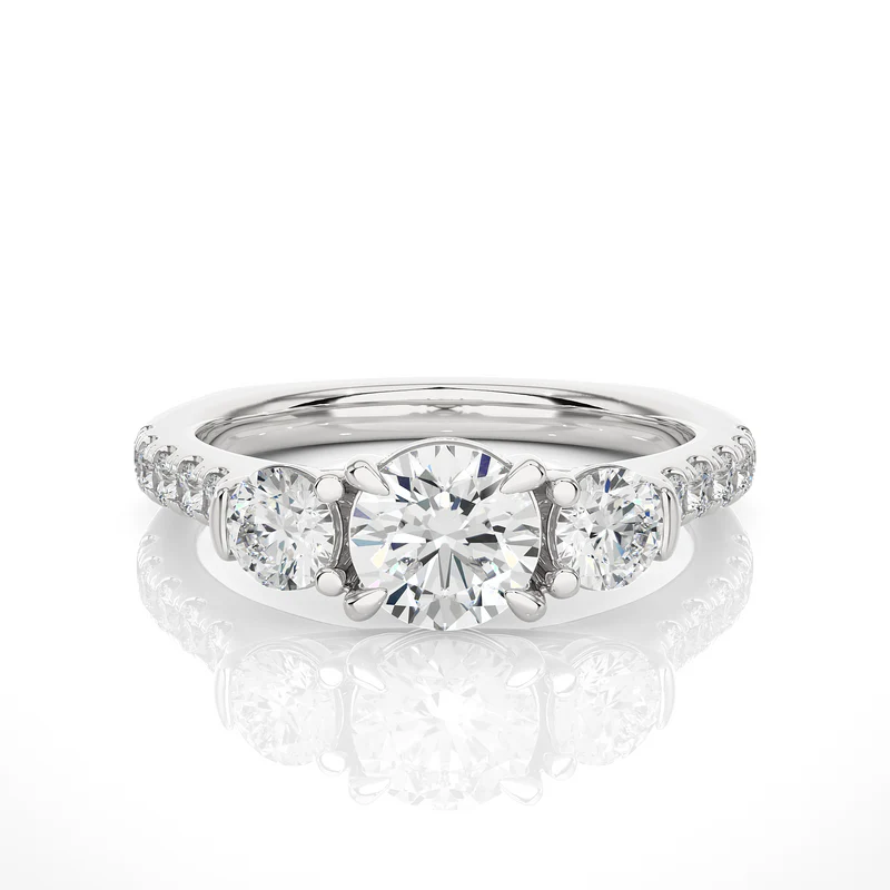 Front view of 2 Carat Round Moissanite Engagement Three Stone Ring In White Gold, highlighting the brilliant center moissanite stone.