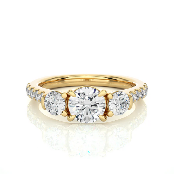 Front view of 2 Carat Round Moissanite Engagement Three Stone Ring In Yellow Gold, highlighting the brilliant center moissanite stone.