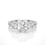 Load image into Gallery viewer, Front view of 2 Carat Round Moissanite Filigree Three Stone Engagement Ring in White Gold, highlighting the brilliant center moissanite stone.
