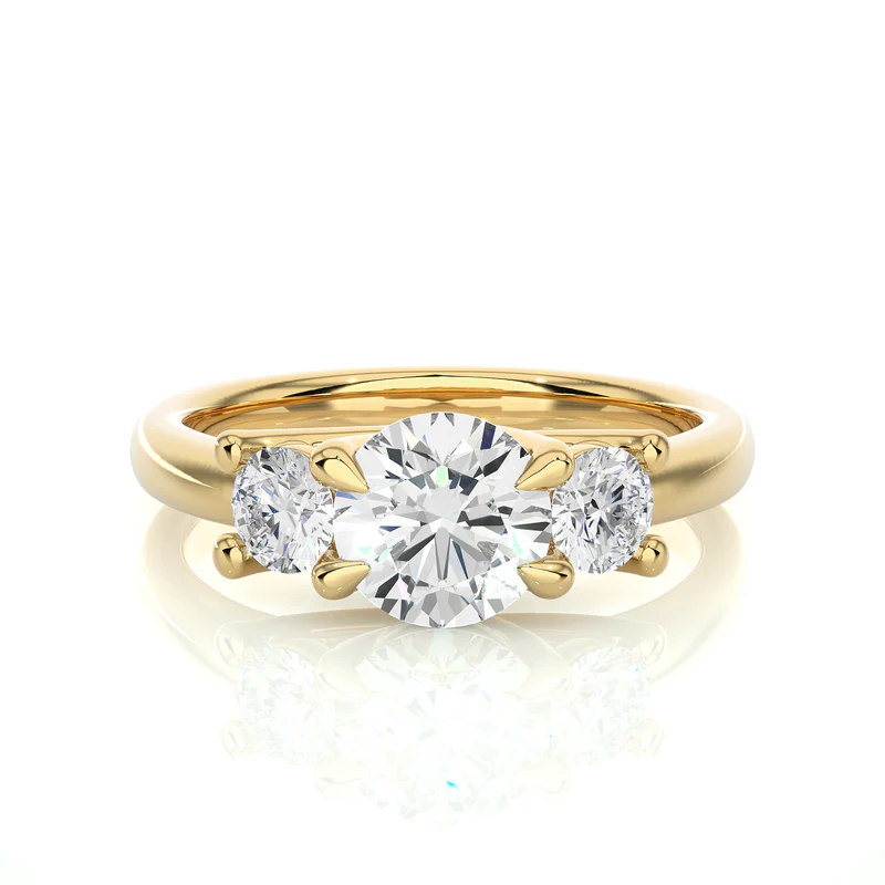 Front view of 2 carat round moissanite three stone engagement ring in yellow gold, highlighting the brilliant center moissanite stone