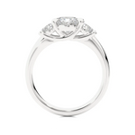 Load image into Gallery viewer, Side profile of 2 Carat Round Moissanite Three Stone Engagement Ring In White Gold, highlighting the prong setting.
