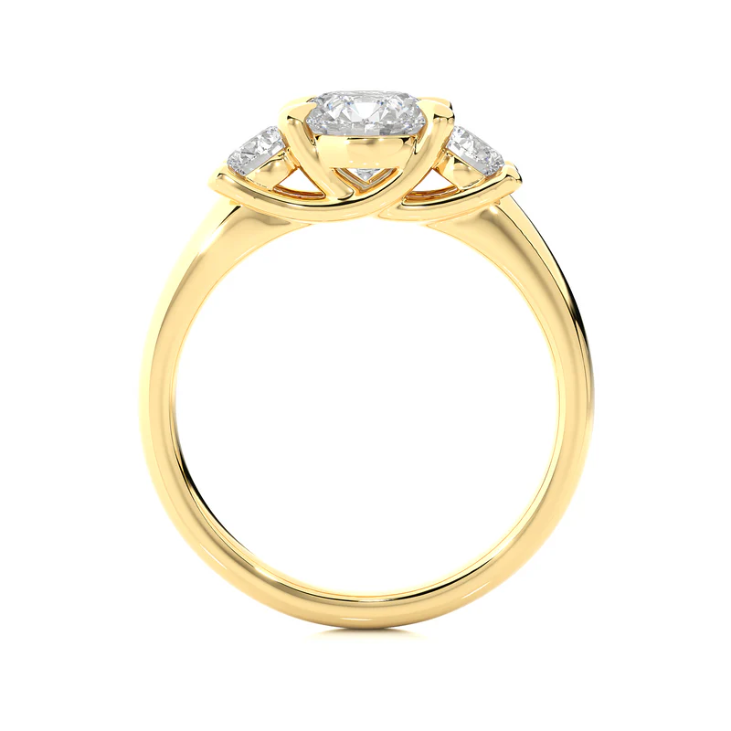Side profile of 2 Carat Round Moissanite Three Stone Engagement Ring In Yellow Gold, highlighting the prong setting.