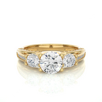 Load image into Gallery viewer, Front view of 2 Carat Moissanite Three Stone Engagement Ring With Accents in Yellow Gold, highlighting the brilliant center moissanite stone.
