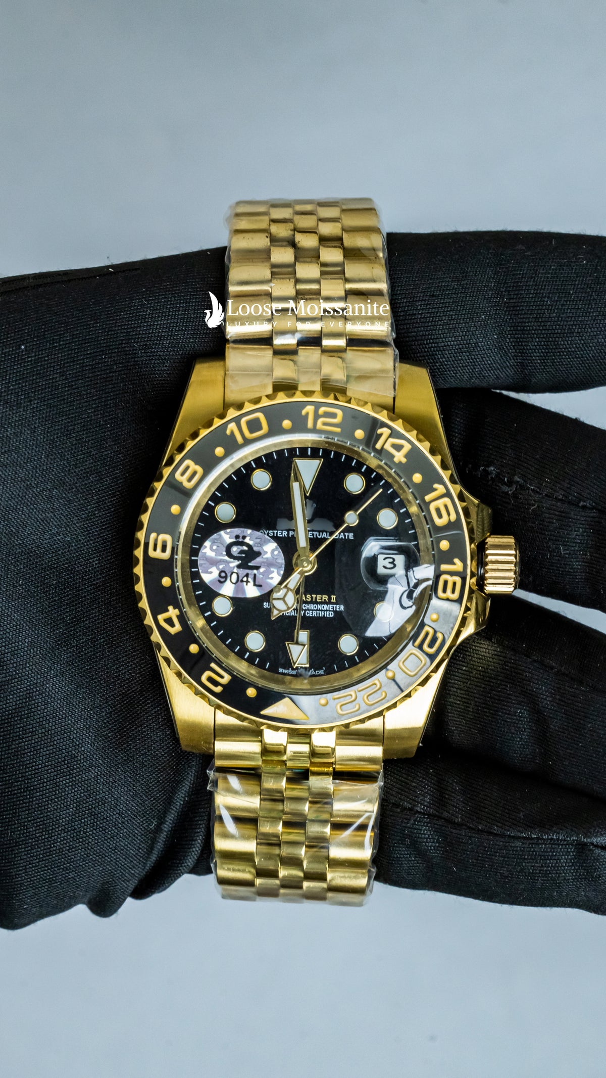 Front view of oyster perpetual datejust black dial plain watch in yellow gold