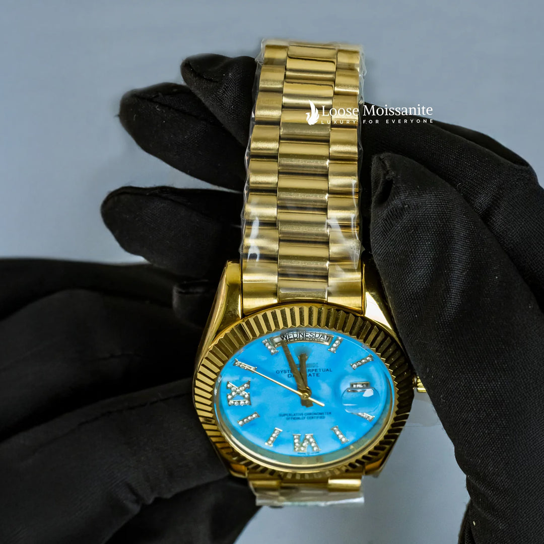 Close Up View Of Oyster Perpetual Day-Date Sky Blue Dial Plain Watch In Yellow Gold