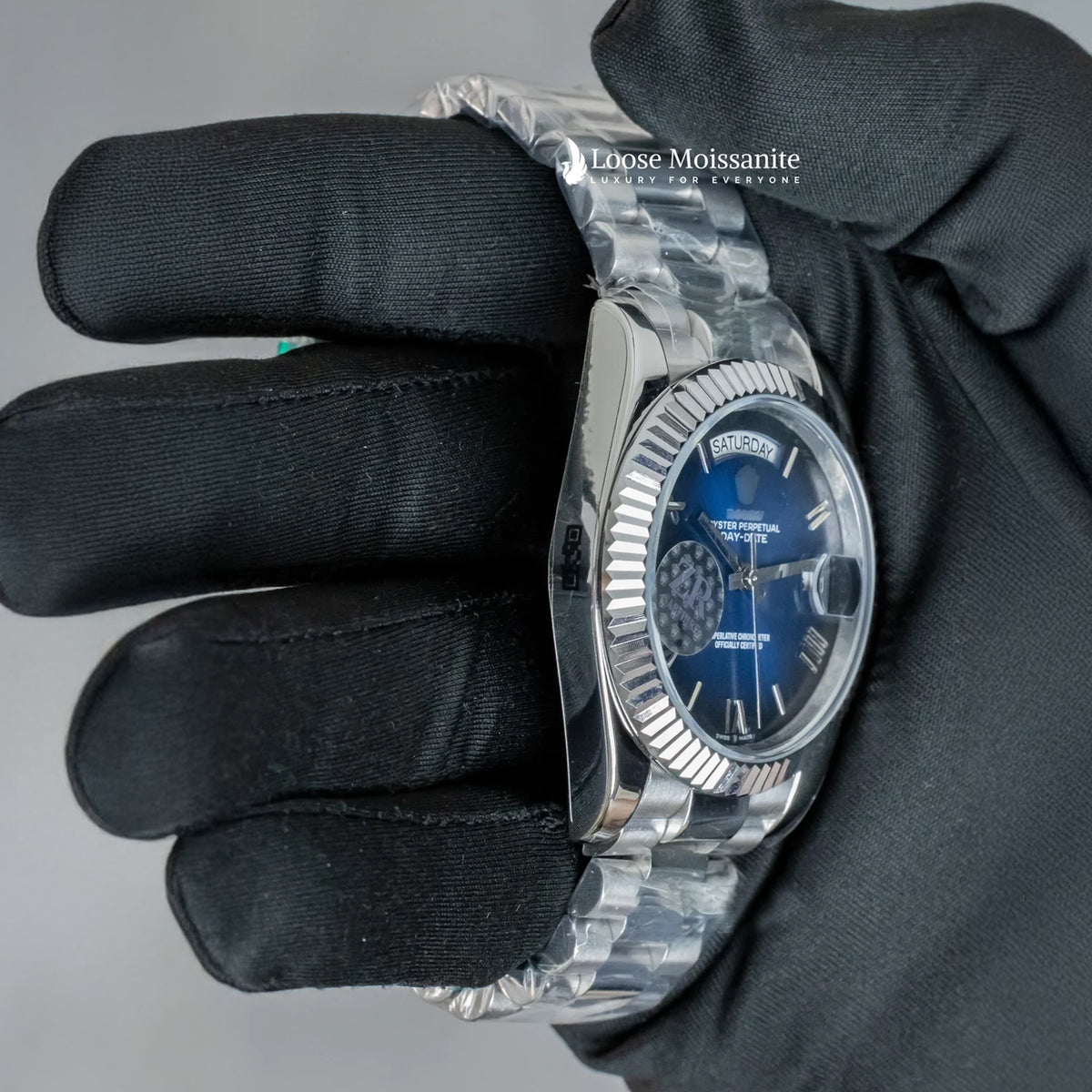 Side view of day date blue dial stainless steel plain watch