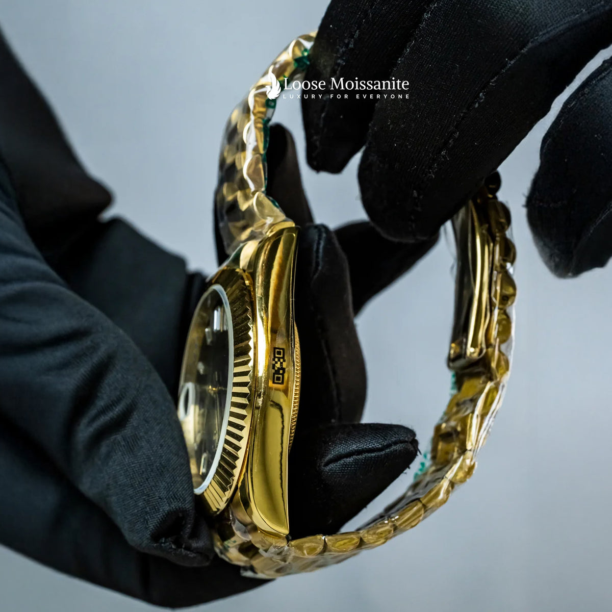 Side view of oyster perpetual day date black dial plain watch in yellow gold