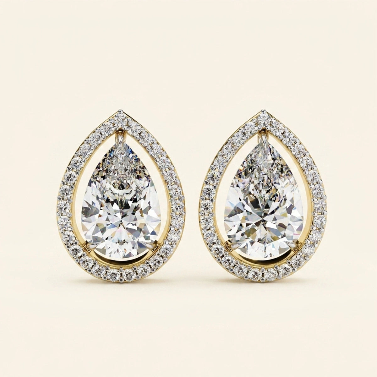 Front view of pear halo stud earrings