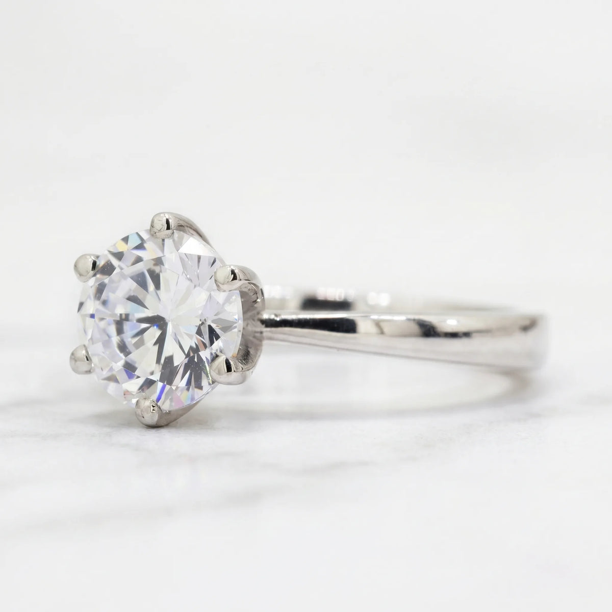 1 ct round six prong moissanite solitaire ring in silver