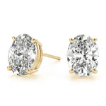 Load image into Gallery viewer, 0.50 - 5 Carat Oval Cut Solitaire Moissanite Stud Earrings in Yellow Gold
