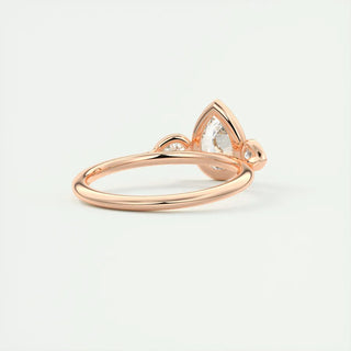 2 Carat Pear Cut Three Stone Bezel Set Moissanite Ring in Rose Gold