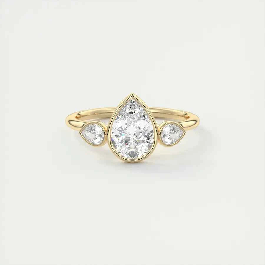 2 Carat Pear Cut Three Stone Bezel Set Moissanite Ring in Rose Gold