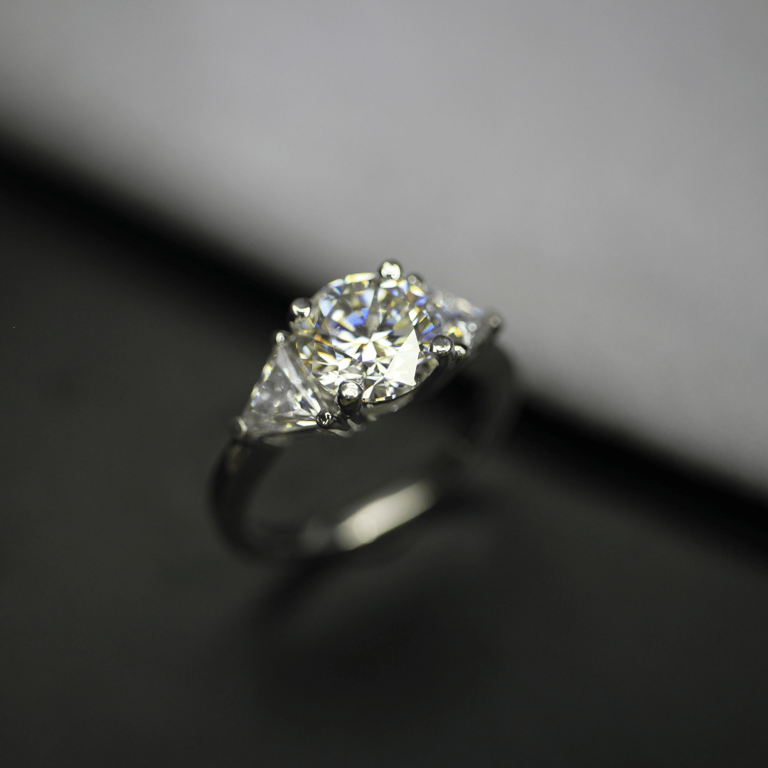 3 carat round and trillion cut moissanite three stone ring