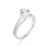 Load image into Gallery viewer, Angled view of 1.40 Ct Round Cut Moissanite Split Shank Engagement Ring In White Gold, showcasing the band and setting.​
