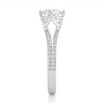Load image into Gallery viewer, Side profile of 1.40 Ct Round Cut Moissanite Split Shank Engagement Ring In White Gold, highlighting the prong setting.

