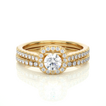 Load image into Gallery viewer, Front view of 1.50 Carat Halo Moissanite Bridal Set With Accents in Yellow Gold, highlighting the brilliant center Moissanite stone.
