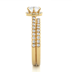 Load image into Gallery viewer, 1.50 Carat Halo Moissanite Bridal Set With Accents in Yellow Gold
