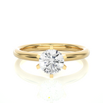 Load image into Gallery viewer, Front view of 1.50 Carat Round Cut Moissanite Solitaire Engagement Ring In Yellow Gold, highlighting the brilliant center moissanite stone.

