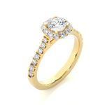 Load image into Gallery viewer, Angled view of 1.50 Carat Round Moissanite Halo Engagement Ring In Yellow Gold, showcasing the band and setting.​
