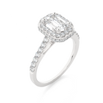 Load image into Gallery viewer, Angled view of 1.50 Ct Emerald Cut Moissanite Halo Engagement Ring In White Gold, showcasing the band and setting.​
