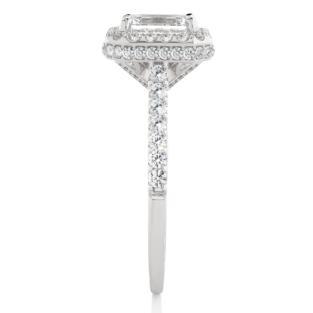 Side profile of 1.50 Ct Emerald Cut Moissanite Halo Engagement Ring In White Gold, highlighting the prong setting.