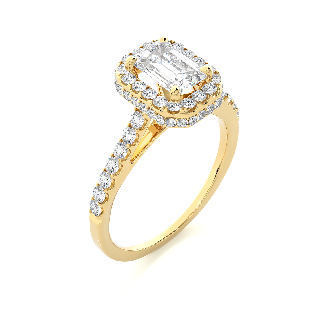 Angled view of 1.50 Ct Emerald Cut Moissanite Halo Engagement Ring In Yellow Gold, showcasing the band and setting.​