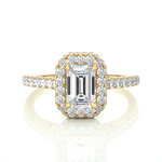 Load image into Gallery viewer, Front view of 1.50 Ct Emerald Cut Moissanite Halo Engagement Ring In Yellow Gold, highlighting the brilliant center Moissanite stone.
