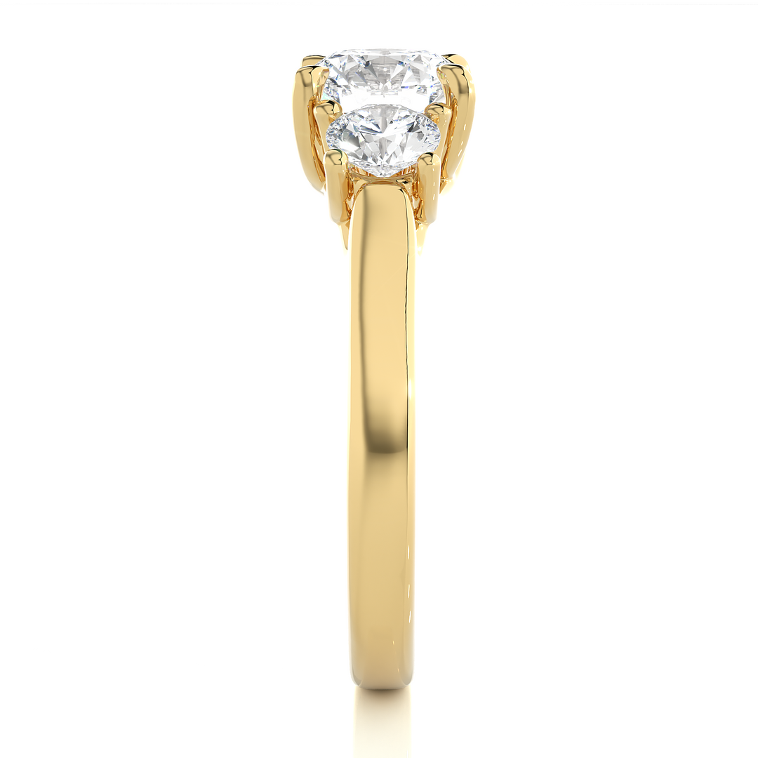 Side profile of 1.50 Ct Round Moissanite Three Stone Engagement Ring In Yellow Gold, highlighting the brilliant center moissanite stone., highlighting the prong setting.