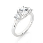 Load image into Gallery viewer, Angled view of 1.50 Ct Round Moissanite Three Stone Engagement Ring in White Gold, showcasing the band and setting.​
