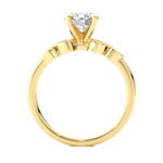 Load image into Gallery viewer, Side profile of Front view of 1.50 Ct Round cut Moissanite Five Stone Engagement Ring In Yellow Gold, highlighting the brilliant center moissanite stone., highlighting the prong setting.
