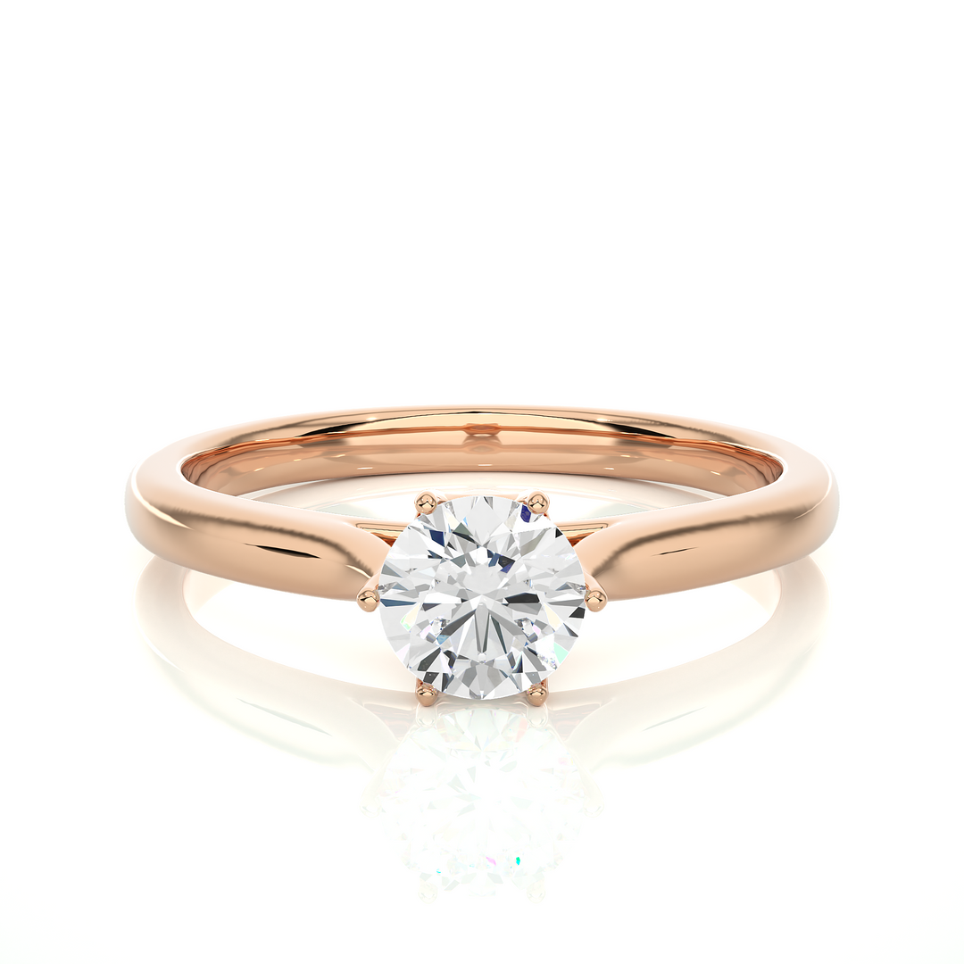 Front view of 1 Carat Round Moissanite Solitaire Engagement Ring In Rose Gold, highlighting the brilliant center moissanite stone.