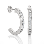 Load image into Gallery viewer, side view of 1ct round moissanite c hoop earrings in silver with bend and some stones showing.
