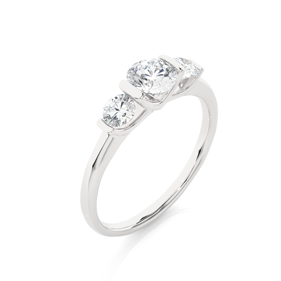 Angled view of 2 Carat Round Cut Moissanite Three Stone Engagement Ring In White Gold, showcasing the band and setting.​