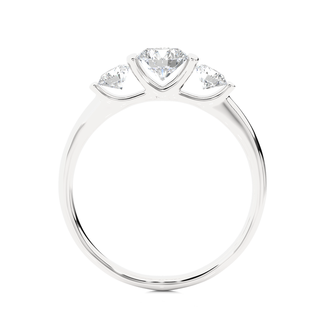 Side profile of 2 Carat Round Cut Moissanite Three Stone Engagement Ring In White Gold, highlighting the brilliant center moissanite stone., highlighting the prong setting.