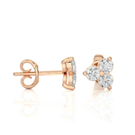 Load image into Gallery viewer, Side view of 2 Carat Round Cut Moissanite Three Stone Stud Earrings In Rose Gold, showing depth and setting details.
