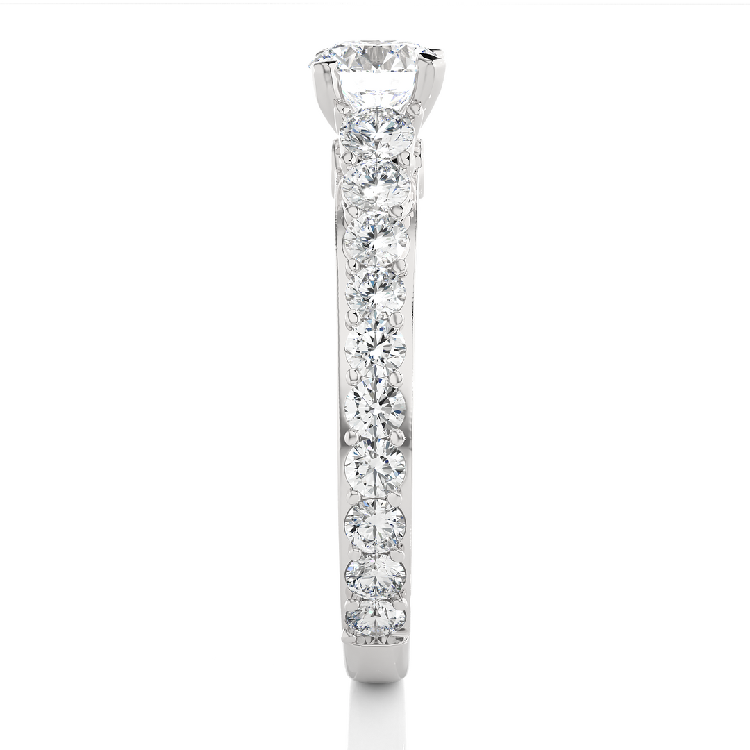 Side profile of 2 Ct Bridge Set Moissanite Engagement Ring With Accent In Silver, highlighting the prong setting.