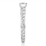 Load image into Gallery viewer, Side profile of 2 Ct Bridge Set Moissanite Engagement Ring With Accent In White Gold, highlighting the prong setting.

